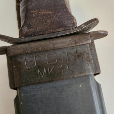 Sale Photo Thumbnail #9: This auction lot is if a WW2 US Navy Combat Knife & Sheath.  This nifty military collectible is marked as former property of the USN.  Nice item for the military or knife collector.