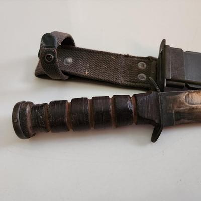 Sale Photo Thumbnail #12: This auction lot is if a WW2 US Navy Combat Knife & Sheath.  This nifty military collectible is marked as former property of the USN.  Nice item for the military or knife collector.