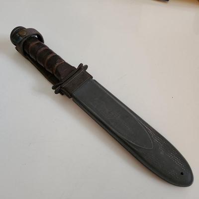 Sale Photo Thumbnail #7: This auction lot is if a WW2 US Navy Combat Knife & Sheath.  This nifty military collectible is marked as former property of the USN.  Nice item for the military or knife collector.