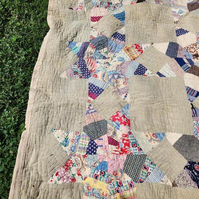 Sale Photo Thumbnail #2: This auction lot is for an Antique Crazy Star Quilt.  This quilt has been spread on a few beds but has a nice antique look and feel.  The verso shows that it was backed with old feed sacks from Louisville, KY.  Overall the quilt is good, the backing has a