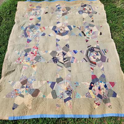 Sale Photo Thumbnail #1: This auction lot is for an Antique Crazy Star Quilt.  This quilt has been spread on a few beds but has a nice antique look and feel.  The verso shows that it was backed with old feed sacks from Louisville, KY.  Overall the quilt is good, the backing has a