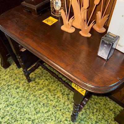 Sale Photo Thumbnail #7: Small table with removable shelf. Does NOT include items on top of table. See pictures for signs of typical wear.
Roughly 30" tall, 37" wide, 18.5" deep