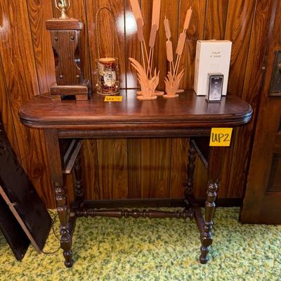 Sale Photo Thumbnail #6: Small table with removable shelf. Does NOT include items on top of table. See pictures for signs of typical wear.
Roughly 30" tall, 37" wide, 18.5" deep