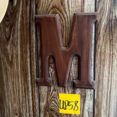 Sale Photo Thumbnail #174: Hat, antler rack, wooden letter M, etc.