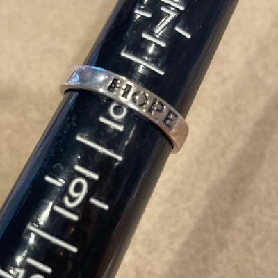 Fancy sterling necklace with ring that says Hope