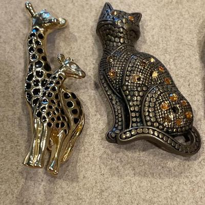 Pewter and gold tone rings and pins