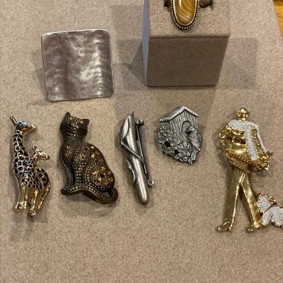 Pewter and gold tone rings and pins