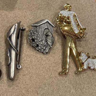 Pewter and gold tone rings and pins