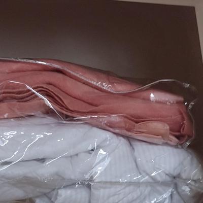 Assorted Bedding, Linens, and Contents of Closet