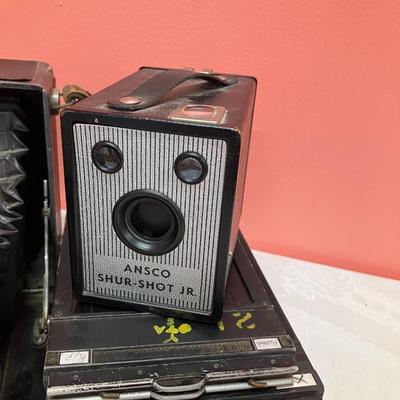 Sale Photo Thumbnail #63: 2 cameras: B&J camera set with film cartridges and 1 Ansco sure shot jr. camera