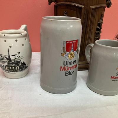 Sale Photo Thumbnail #75: Lot includes a vintage ice bucket, 3 beer steins and 2 tall pilsner glasses