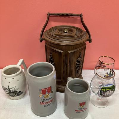 Sale Photo Thumbnail #74: Lot includes a vintage ice bucket, 3 beer steins and 2 tall pilsner glasses