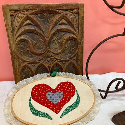 Sale Photo Thumbnail #99: Grouping of a rooster plate holder, vintage iron, vintage wooden spool, a ceramic decorative tile, and a quilted heart decor piece