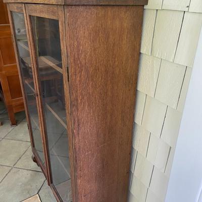Vintage double-door rolling glass cabinet/bookshelf