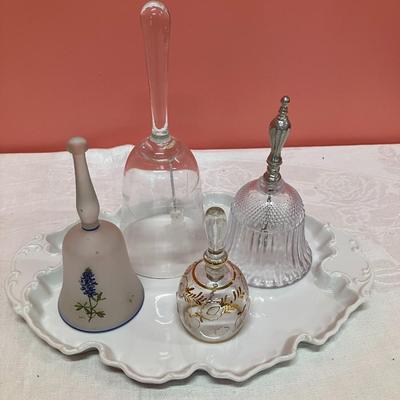 Sale Photo Thumbnail #132: Grouping of 4 unique glass bells on a white ceramic vintage plate
