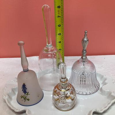 Sale Photo Thumbnail #134: Grouping of 4 unique glass bells on a white ceramic vintage plate