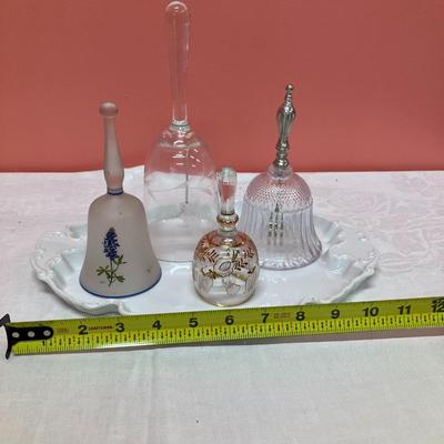 Sale Photo Thumbnail #133: Grouping of 4 unique glass bells on a white ceramic vintage plate