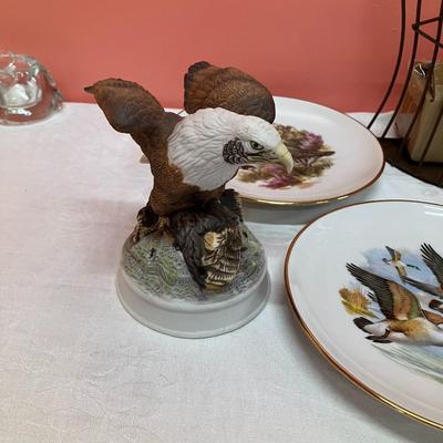 Sale Photo Thumbnail #145: Grouping of 6 collectible bird plates, a bird cage votive candle holder, and a collectible bald eagle figurine