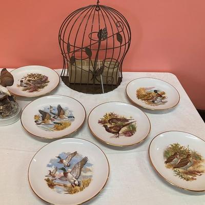Sale Photo Thumbnail #142: Grouping of 6 collectible bird plates, a bird cage votive candle holder, and a collectible bald eagle figurine
