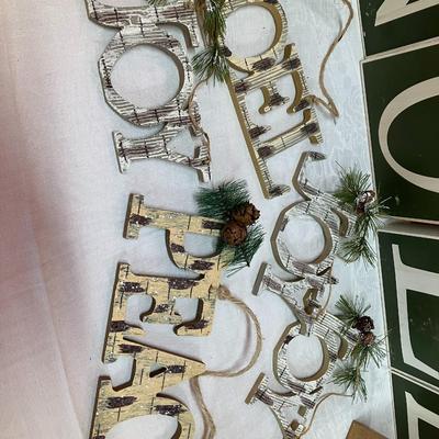 Sale Photo Thumbnail #170: Grouping of pine tree themed holiday decor including: Large NOEL block letters, 5 word hanging decor pieces, 2 small shadow boxes and a Yankee candle plate/topper set