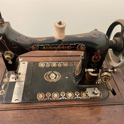 Vintage "Unique" sewing machine, cabinet & extras
