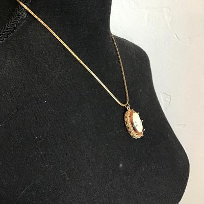 Sale Photo Thumbnail #130: Beautiful, gold tone, cameo pendant necklace. Please see attached photos.