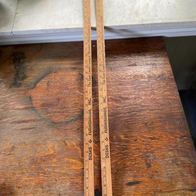 Pair of advertising yard sticks