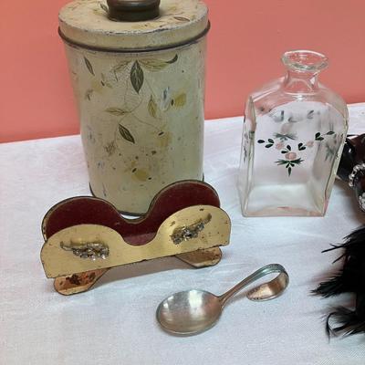 Sale Photo Thumbnail #383: Miscellaneous lot of vintage small items including a glasses holder, silver plate baby spoon, vintage tin, handpainted bottle and BONUS fancy ornament!