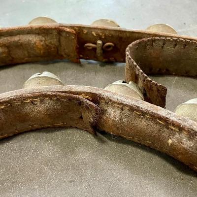String of vintage leather-backed sleigh bells