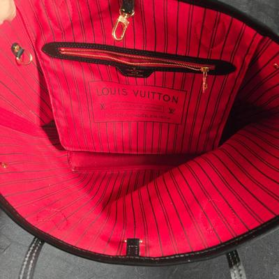 Sale Photo Thumbnail #27: This auction lot is for a Faux LV Bag.  It looks to be unused.  No wear is evident.  It measures about 18-inches wide x 10-inches tall x 5.5-inches wide.  It is a very good fake.  We looked good, searched and hoped for a serial number inside to no avail.
