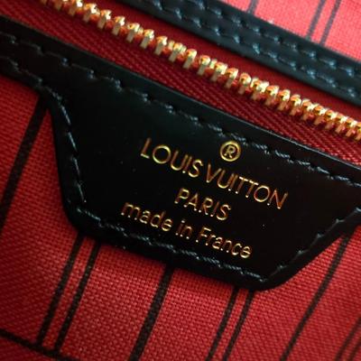 Sale Photo Thumbnail #28: This auction lot is for a Faux LV Bag.  It looks to be unused.  No wear is evident.  It measures about 18-inches wide x 10-inches tall x 5.5-inches wide.  It is a very good fake.  We looked good, searched and hoped for a serial number inside to no avail.