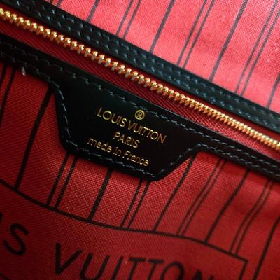 Sale Photo Thumbnail #29: This auction lot is for a Faux LV Bag.  It looks to be unused.  No wear is evident.  It measures about 18-inches wide x 10-inches tall x 5.5-inches wide.  It is a very good fake.  We looked good, searched and hoped for a serial number inside to no avail.