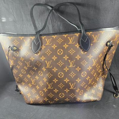 Sale Photo Thumbnail #24: This auction lot is for a Faux LV Bag.  It looks to be unused.  No wear is evident.  It measures about 18-inches wide x 10-inches tall x 5.5-inches wide.  It is a very good fake.  We looked good, searched and hoped for a serial number inside to no avail.