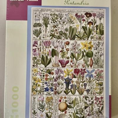 Lot o 4 new jigsaw puzzles