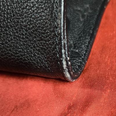 Sale Photo Thumbnail #35: This auction lot is for a Faux Louis Vuitton "On the Go Bag."  It is a quality knock off.  We didn't find any serial numbers inside so we assume it is a fake.  It appears used lightly. Inside is very clean and looks like suede.  There is some light eviden