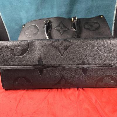 Sale Photo Thumbnail #36: This auction lot is for a Faux Louis Vuitton "On the Go Bag."  It is a quality knock off.  We didn't find any serial numbers inside so we assume it is a fake.  It appears used lightly. Inside is very clean and looks like suede.  There is some light eviden