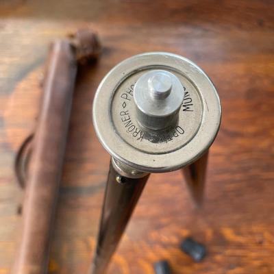 Small camera tripod in leather case
