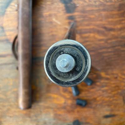 Small camera tripod in leather case