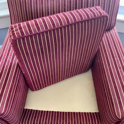 Red upholstered arm chair with matching upholstery fabric