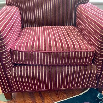 Red upholstered arm chair with matching upholstery fabric