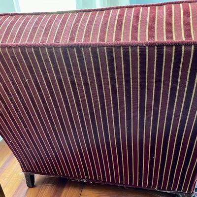 Red upholstered arm chair with matching upholstery fabric