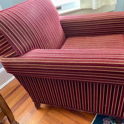Red upholstered arm chair with matching upholstery fabric