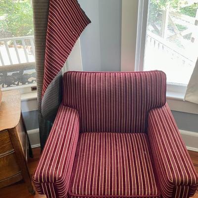 Red upholstered arm chair with matching upholstery fabric