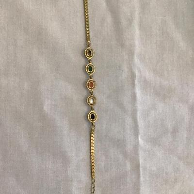 Beautiful gold tone bracelet with multi colored polished stones