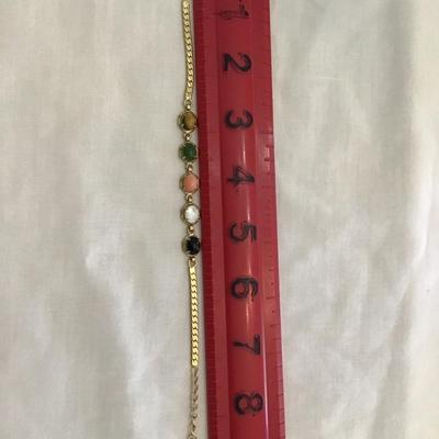 Beautiful gold tone bracelet with multi colored polished stones