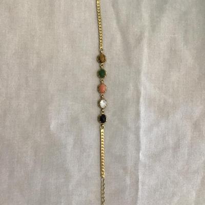 Beautiful gold tone bracelet with multi colored polished stones
