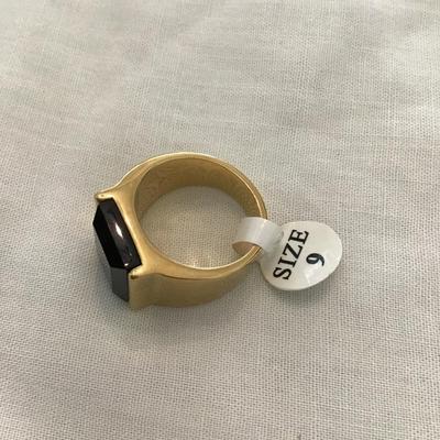 Sale Photo Thumbnail #77: Beautiful gold tone ring with black glass size 9. Please see attached photos.