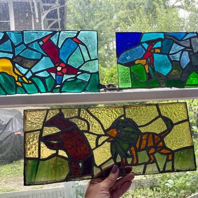Three stained glass window panels