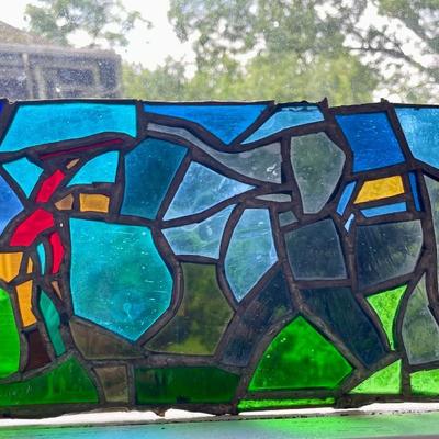 Three stained glass window panels