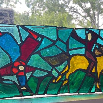 Three stained glass window panels